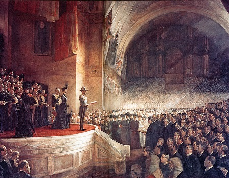 A Austrália nasceu mesmo em 1901, como mostra essa imagem, da abertura do Parlamento Australiano. De lá para cá, o país adotou um sistema político democrático liberal e nunca deixou de ser um reino da Commonwealth, a comunidade das nações que são monarquias parlamentaristas e têm a Rainha Elizabeth II como Chefe de Estado (mas não de governo). (Foto: Wikimedia Commons) A Austrália nasceu mesmo em 1901, como mostra essa imagem, da abertura do Parlamento Australiano. De lá para cá, o país adotou um sistema político democrático liberal e nunca deixou de ser um reino da Commonwealth, a comunidade das nações que são monarquias parlamentaristas e têm a Rainha Elizabeth II como Chefe de Estado (mas não de governo). (Foto: Wikimedia Commons)